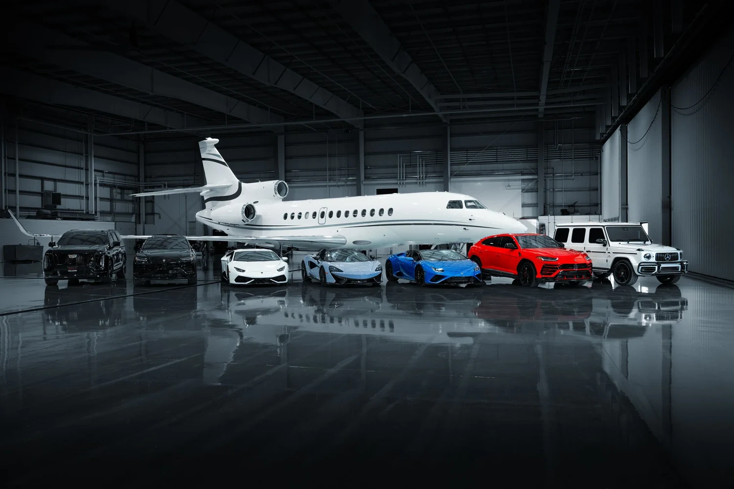 Axel Luxury exotic fleet staged inside a private Chicago hangar